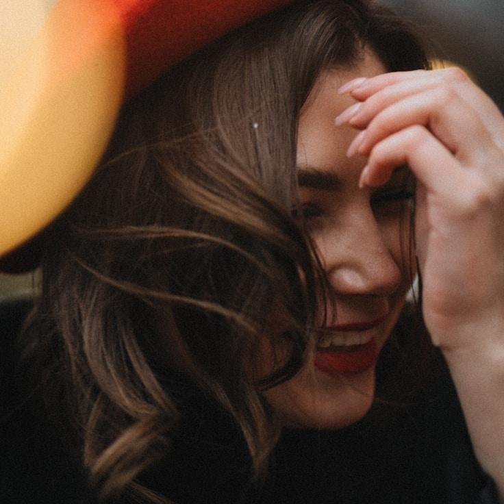 Ava Singh, Lead Design Curator at HarvestLawnWorks, reviewing corporate floral arrangements